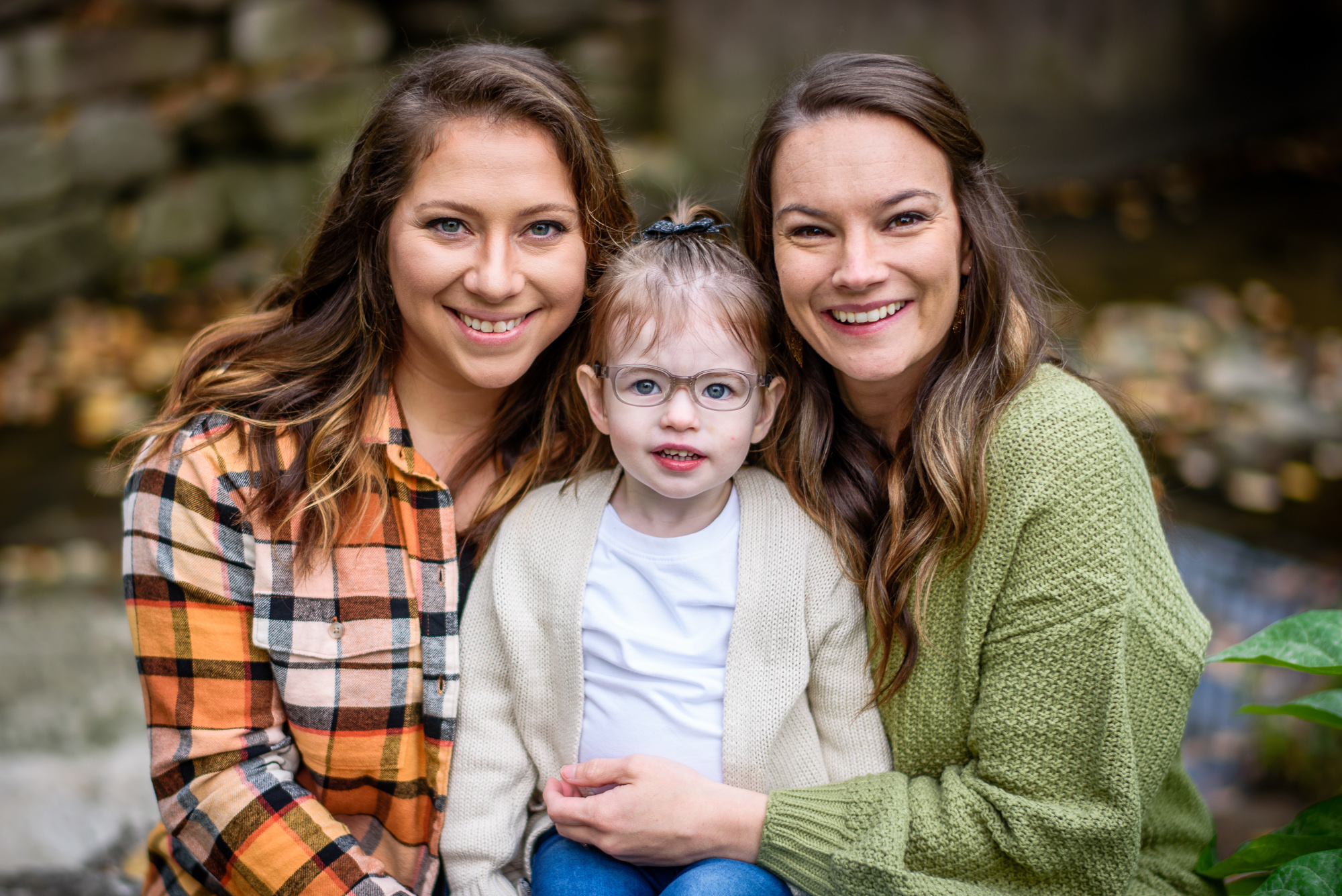 Smiling family at an outdoor fall mini session at Peace Park in Columbia Missouri