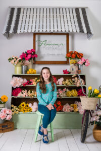 Smiling girl at an indoor spring mini session near Columbia Missouri